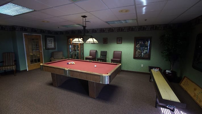Pool table in a cozy common area