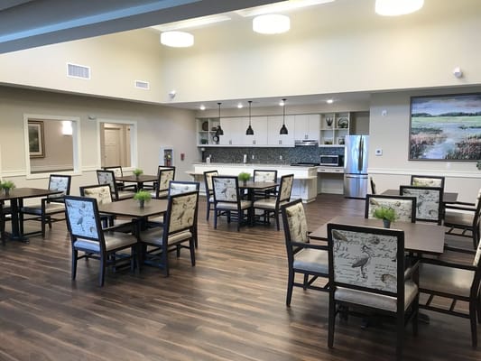Bright dining area with tables and chairs