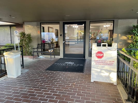 Entrance of Pine Creek Care Center with signage