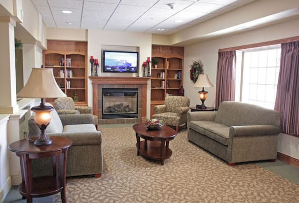 Common area with comfortable seating and a fireplace