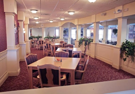 Bright dining room with tables and chairs