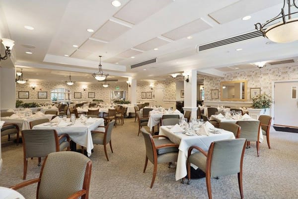 Elegant dining room setup with tables and chairs