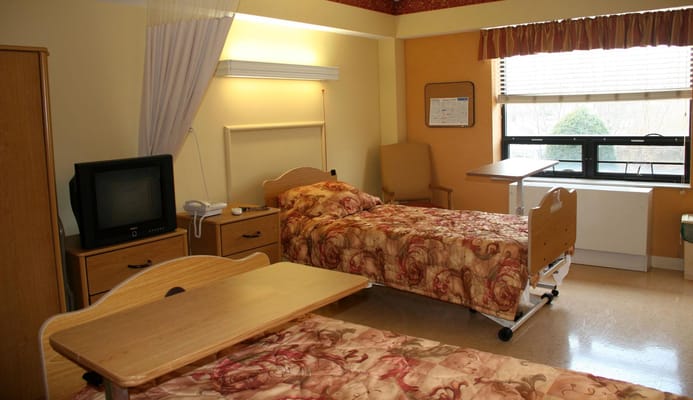 A cozy bedroom with two beds at Providence Rest.