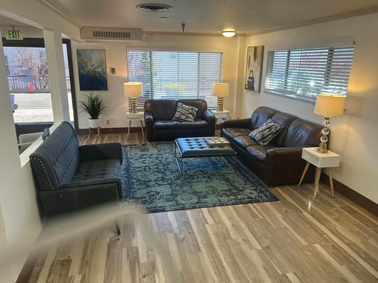 Cozy common area with sofas and lamps