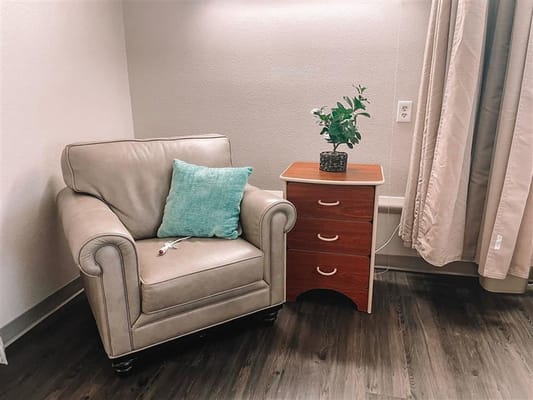 Comfortable chair and side table in a senior living facility