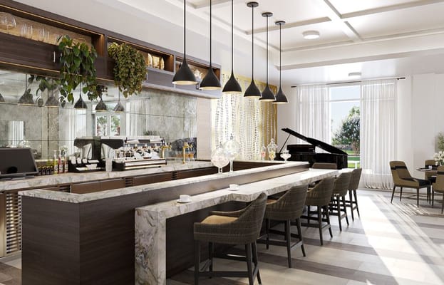 Spacious lounge area with a counter, coffee machine, and piano.