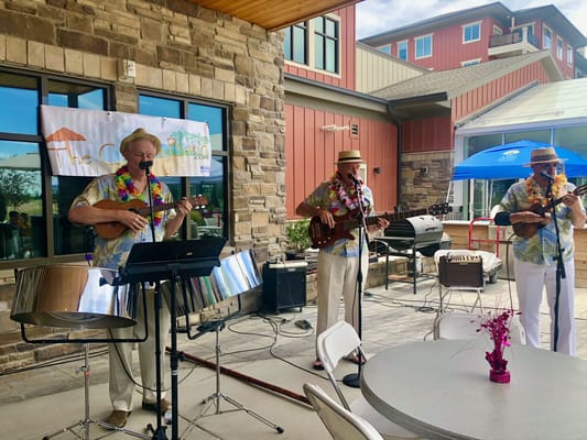 Two musicians performing with instruments at Summit Vista