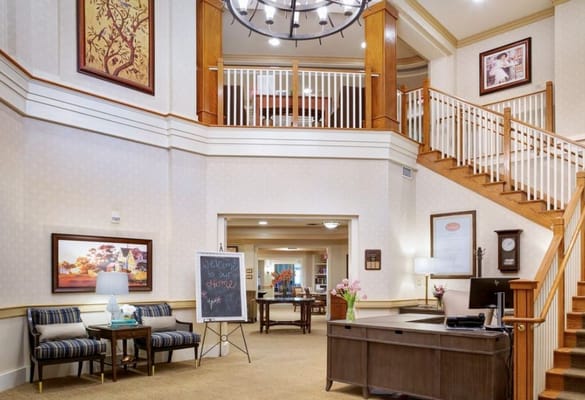 Bright lobby area with seating and a welcoming atmosphere