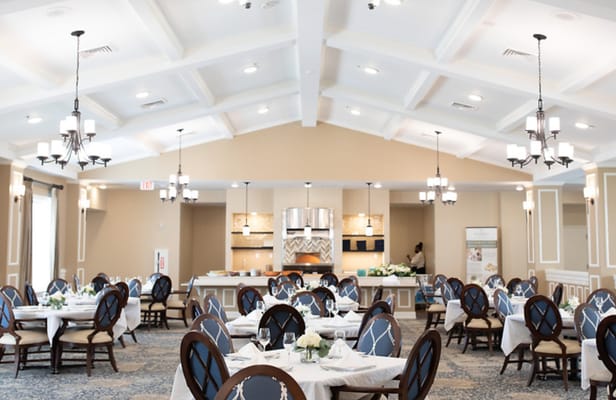 Spacious dining area with tables set for a meal