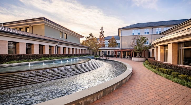 Fountain with cascading water in a landscaped courtyard