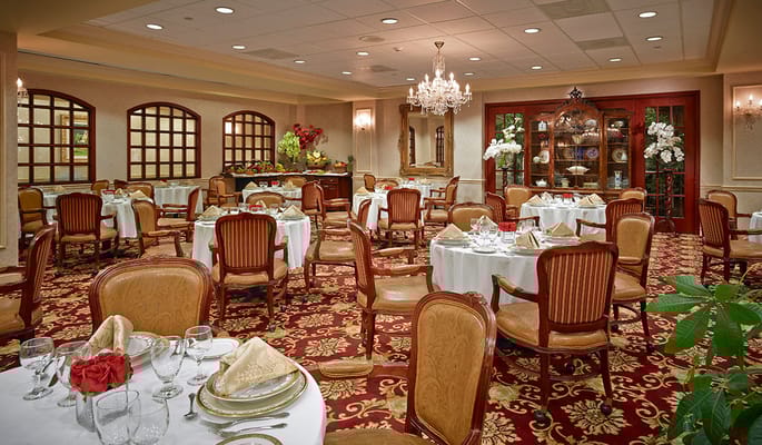 Elegantly set dining room with decorated tables