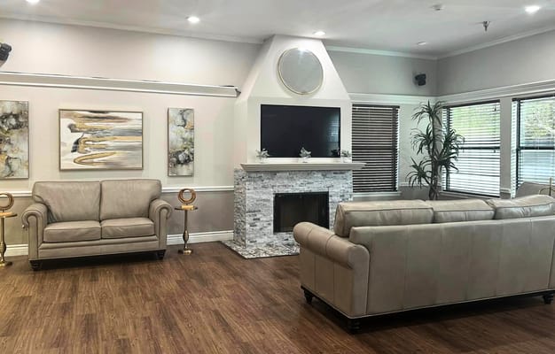 Spacious living room with comfortable couches and a modern fireplace