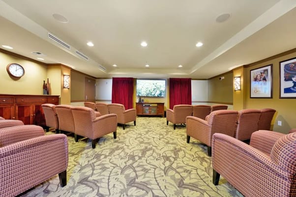 Cozy media room with seating and large screen