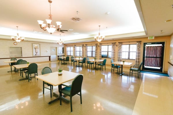 Interior view of a dining room with tables and chairs