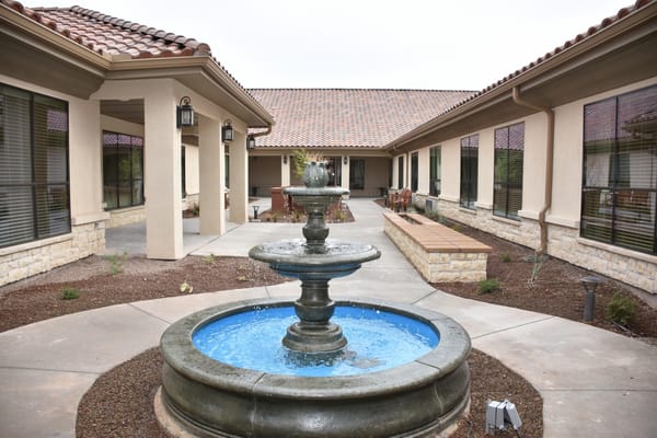 Decorative fountain surrounded by walkways and seating areas