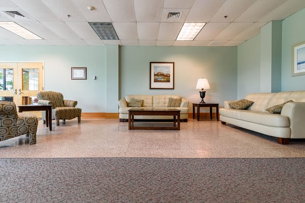 Comfortable lounge area with seating and artwork