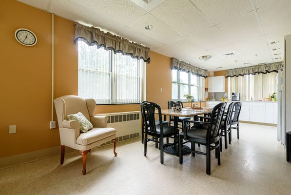 Bright common area with chairs and a table