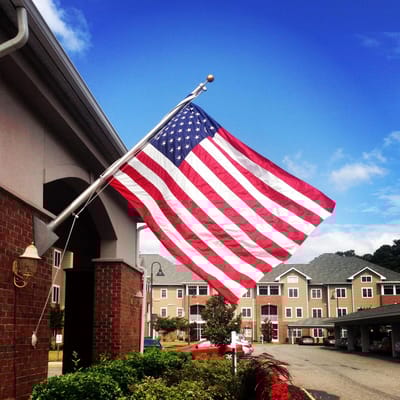 American flag waving in front of the facility