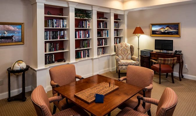 Cozy common area with bookshelves and seating
