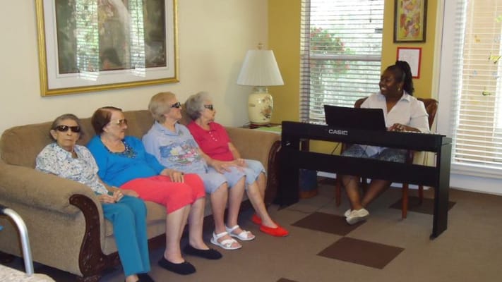 Residents enjoying music in a lounge area
