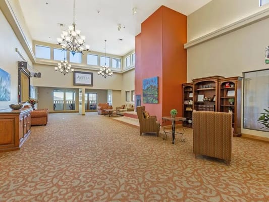 Brightly lit lobby with comfortable seating and decorative accents.