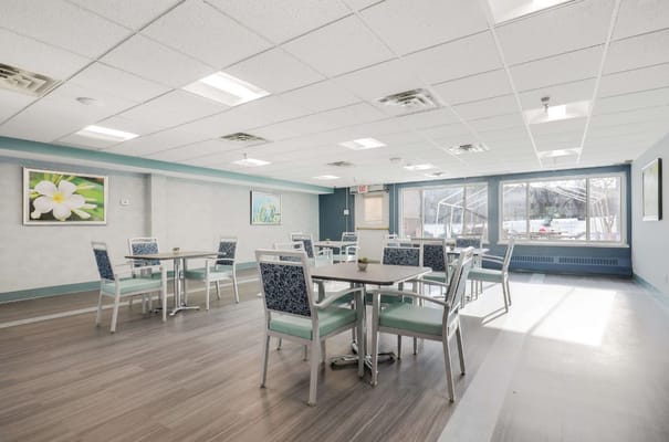 Bright dining room with tables and chairs