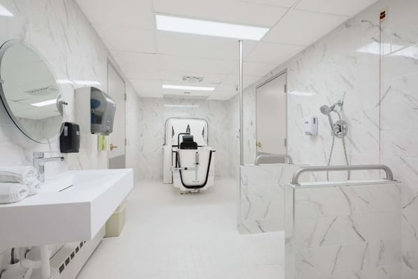 Bright and spacious bathroom with a shower and sink.