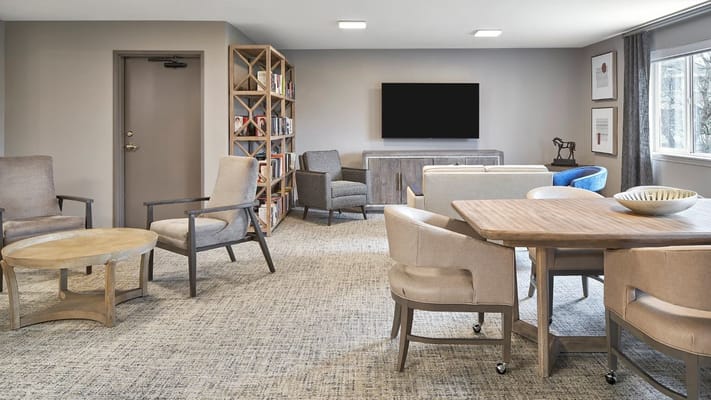 Lounge area featuring comfortable seating and a small table