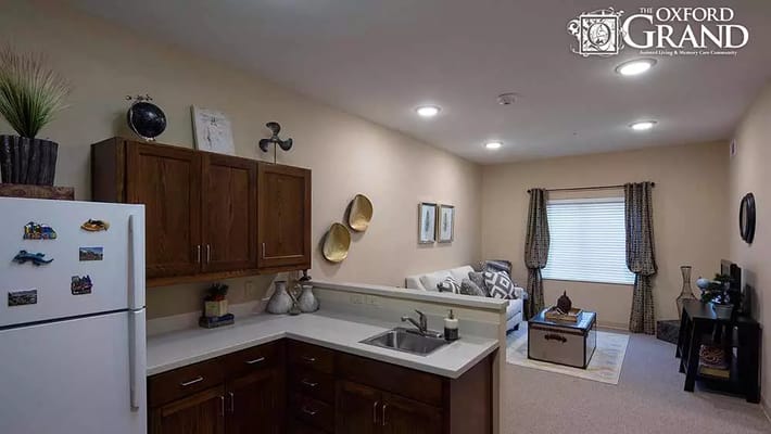 Cozy kitchen and living room space in a senior living facility