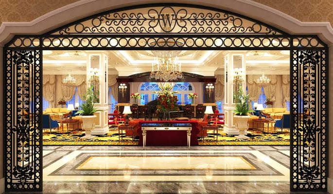 Luxurious lobby area with chandeliers and seating at The Palace at Weston