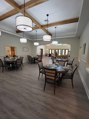Spacious dining area with tables set for a meal.