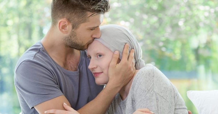 A young couple embracing in a bright space