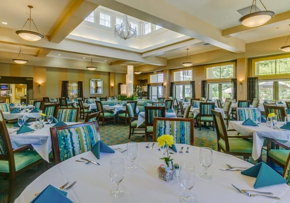 Elegant dining room with neatly set tables and decor
