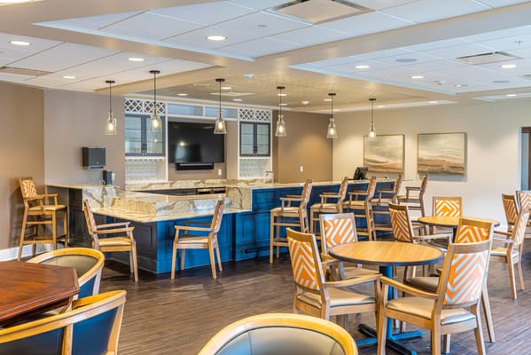 Bright dining area with tables and chairs