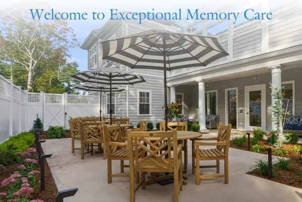 Outdoor seating area with umbrellas and landscaping