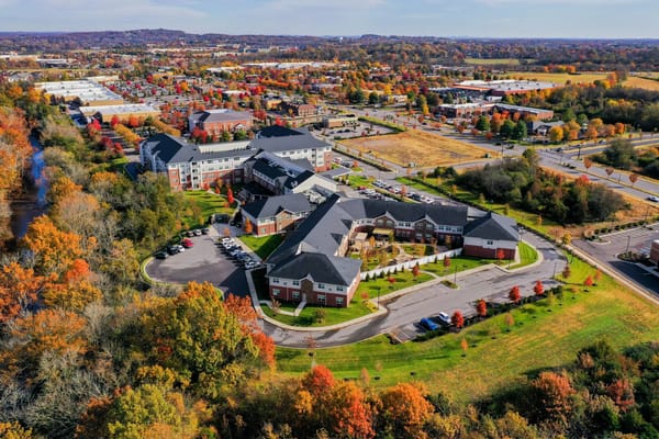 Aerial view of Clarendale at Indian Lake surrounded by autumn foliage