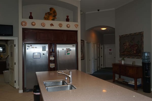 Warm interior kitchen area with cabinets and countertops