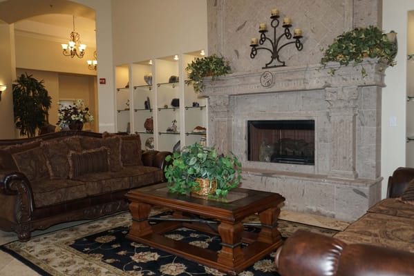 Cozy interior common area with a fireplace and seating