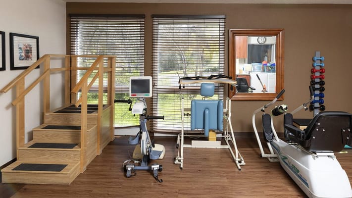 Interior view of a physical therapy room with equipment