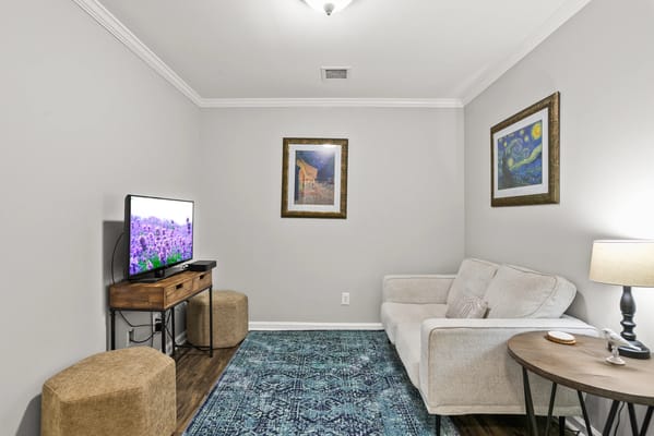 Cozy interior living area with a TV and couch