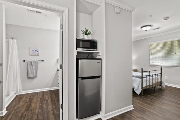 Interior view of a resident room with kitchen amenities