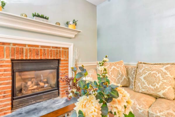 Cozy living room with a fireplace and floral decor