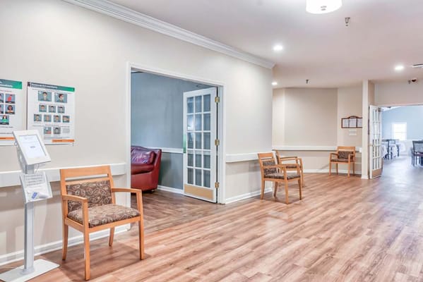 Interior hallway with chairs and open doors