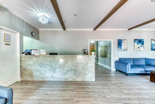 Reception area of an assisted living facility with seating and decor