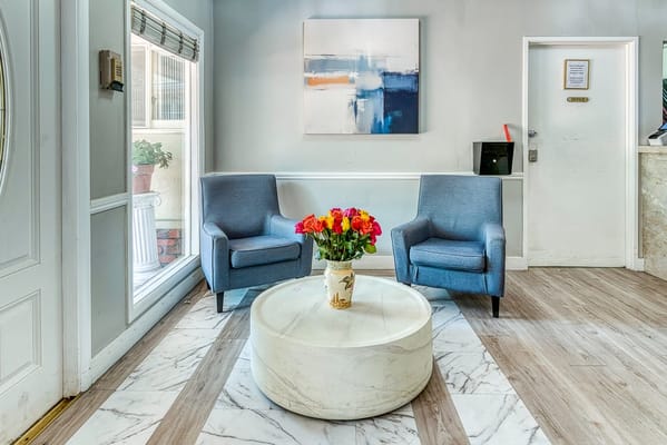 Comfortable lounge area with floral arrangement