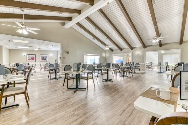 Bright dining room with tables and chairs