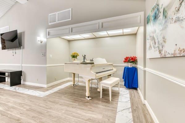 Interior view of a common area with a piano