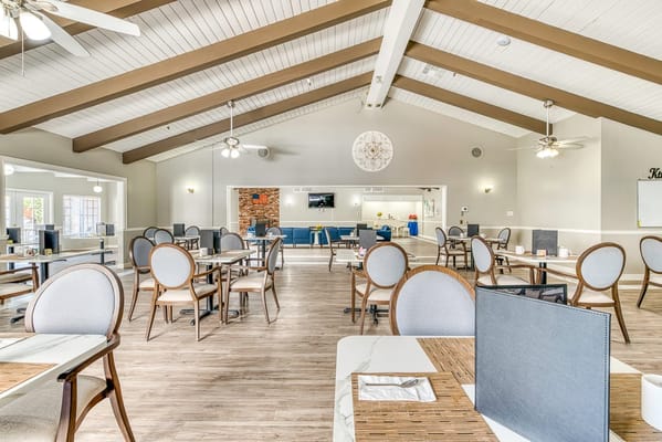 Bright dining area with tables and chairs