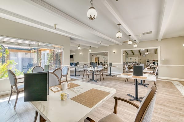 Bright dining area with tables and seating