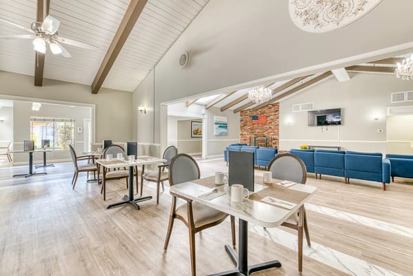 Bright dining area with tables and seating